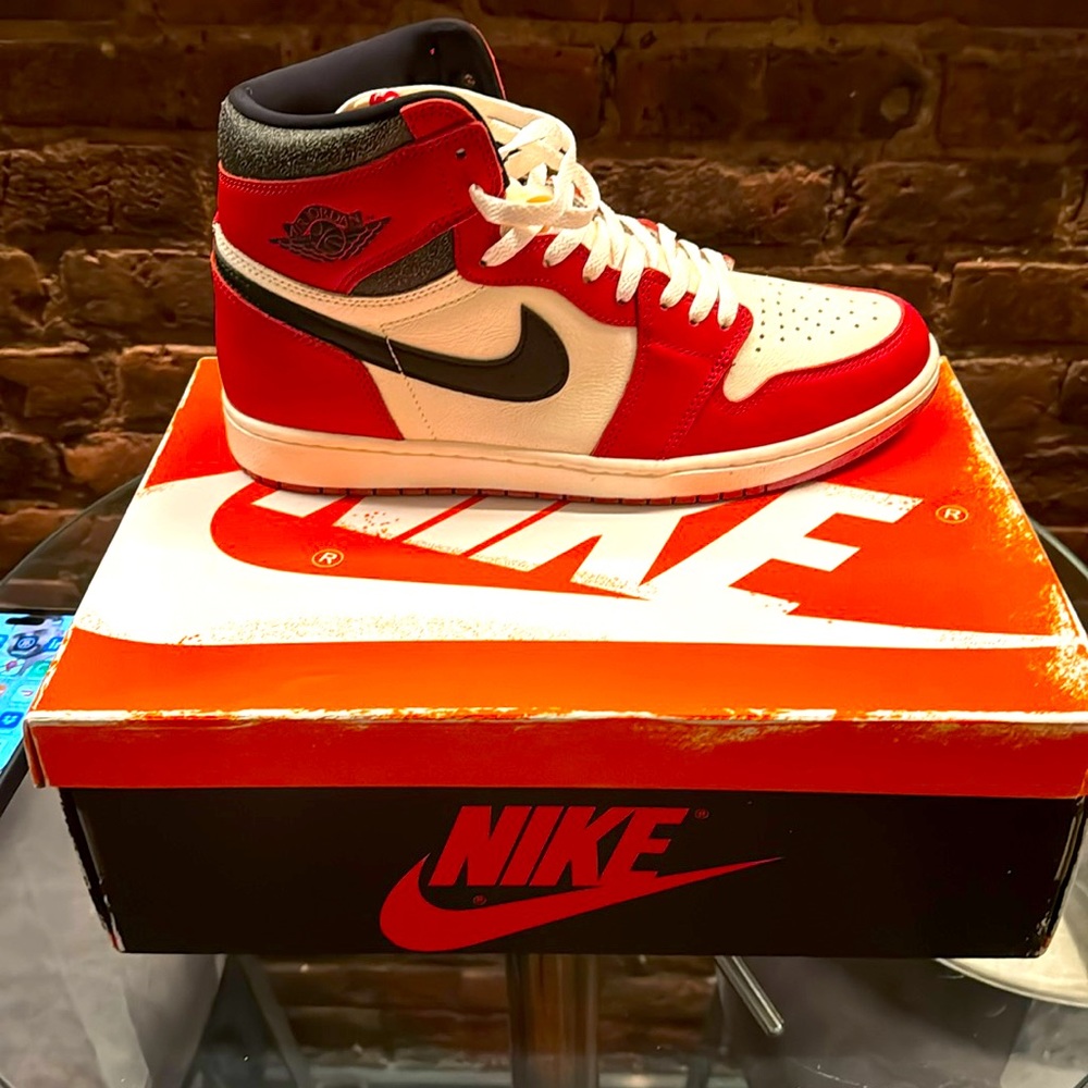 NIKE JORDAN 1s RETRO HIGH OG LOST AND FOUND VARSITY RED